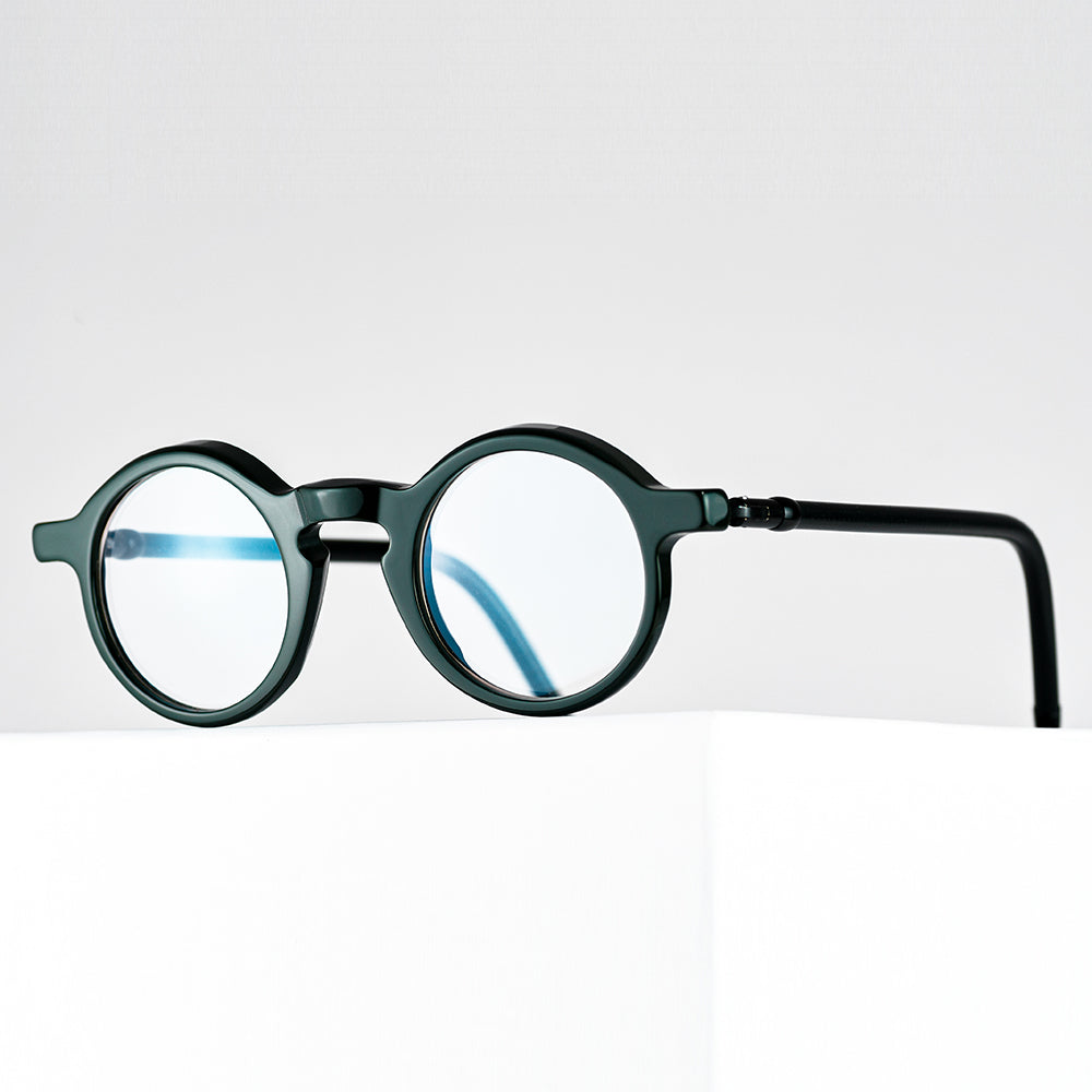 The unisex Aimo features large lenses, and temples made from upcycled bicycle brake cables- Vinylize eyewear