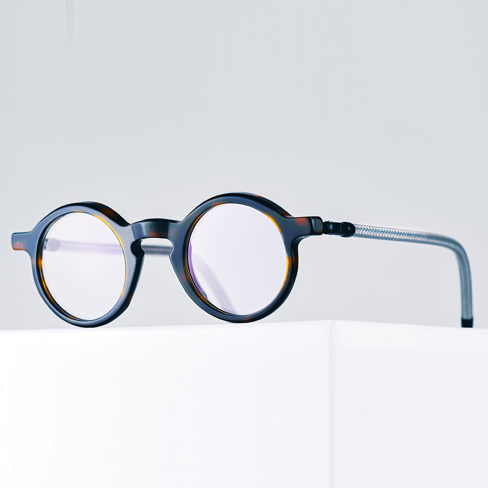 Round eyeglasses- The unisex Aimo features large lenses, and temples made from upcycled bicycle brake cables- Vinylize eyewear