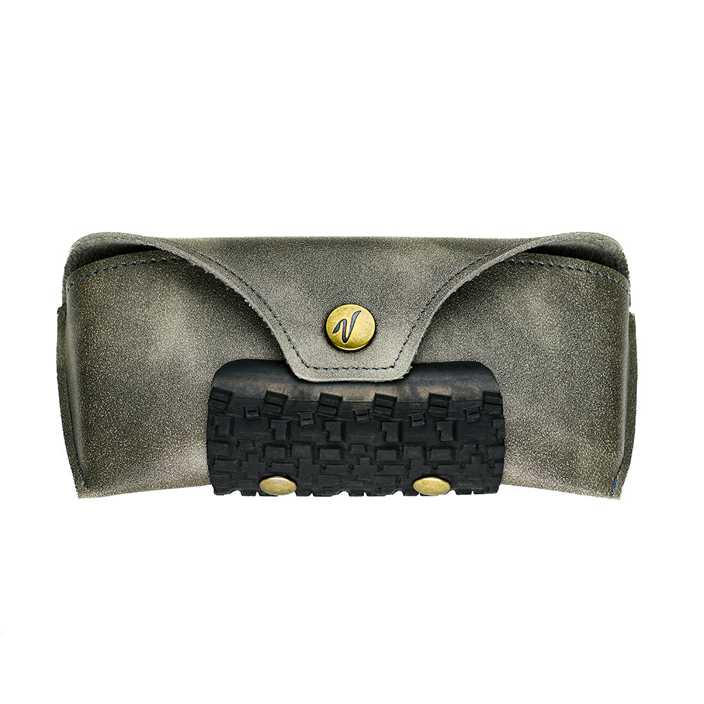 Sunglasses case box with a black textured bottom and gold emblem 