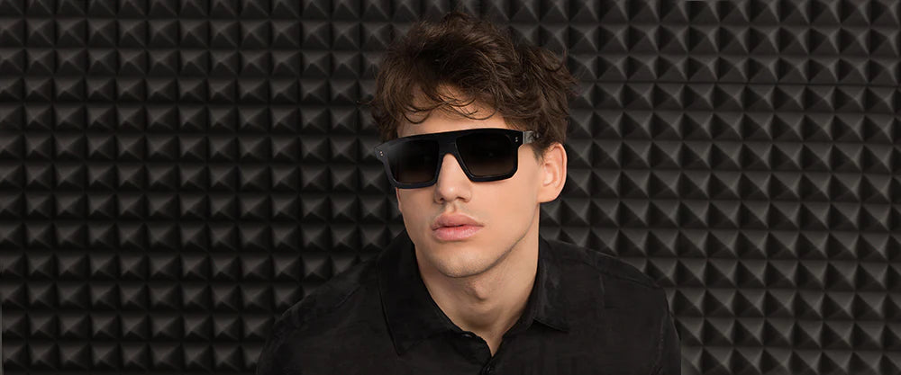 Black, large rectangular sunglasses with a metallic frame and clear lenses.