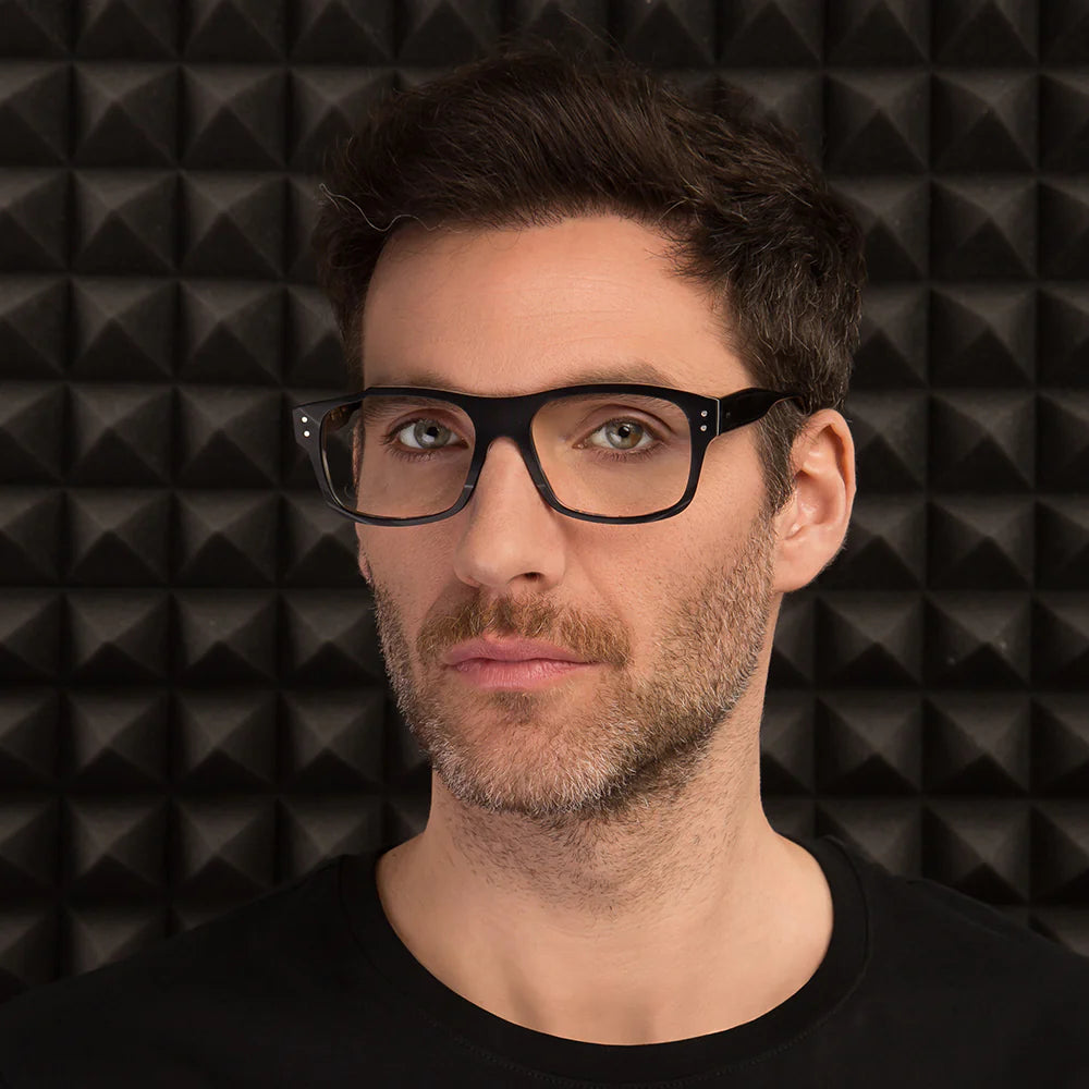 A pair of black Jackson sunglasses with blue accents on the arms and a record-inspired design on the frames.