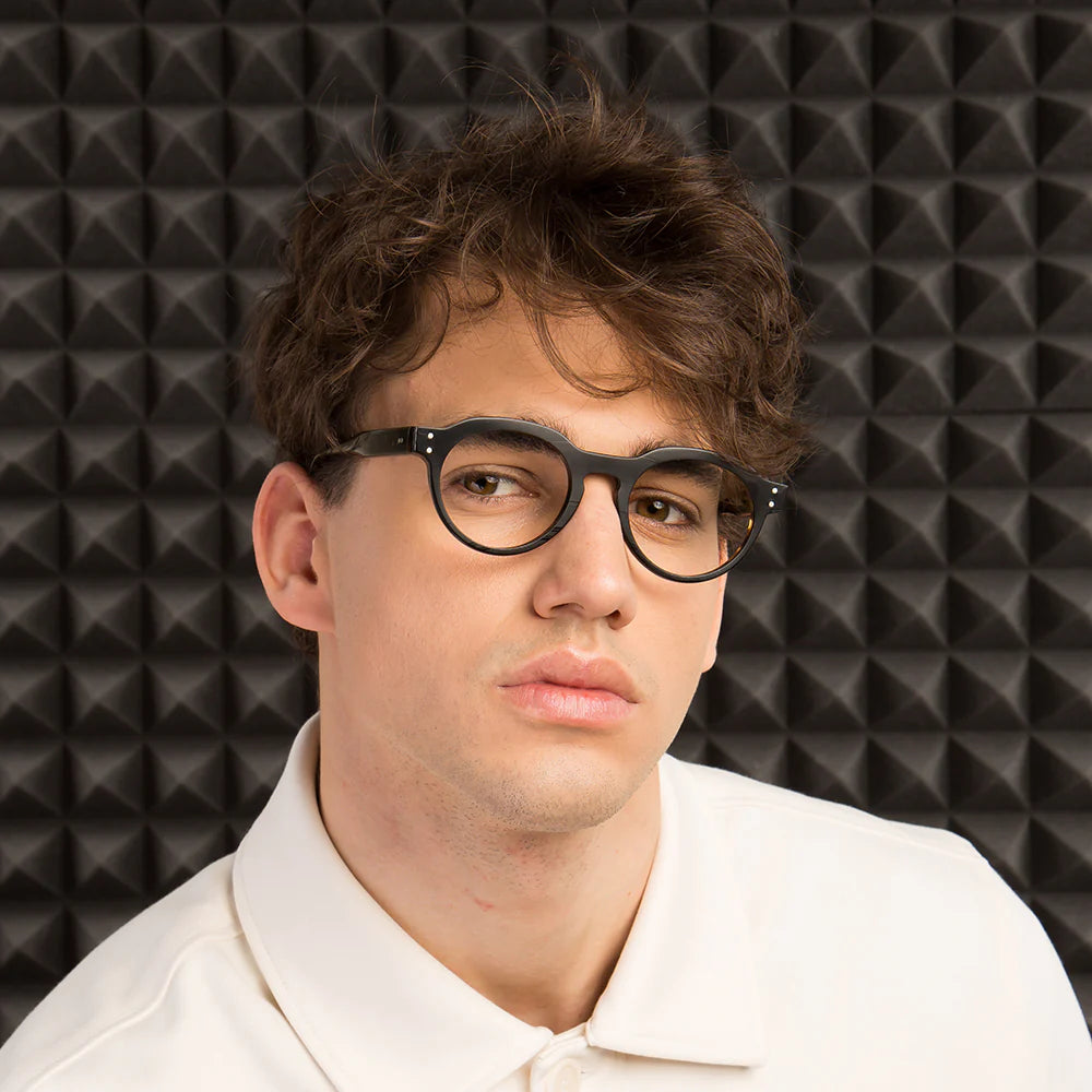 Round full-frame eyeglasses with a brown record-like texture and black accents on the arms.