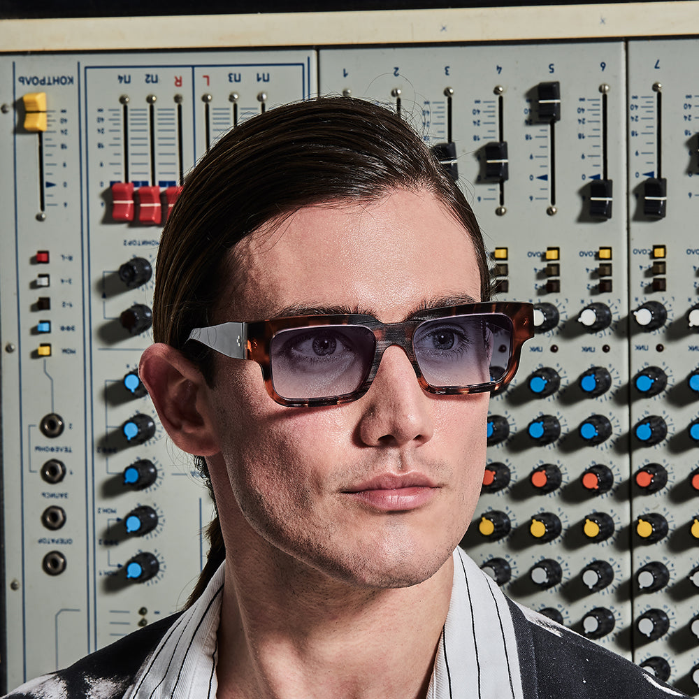 Black, rectangle-shaped eyeglasses with prominent temples and lenses that appear to be made of a durable material.