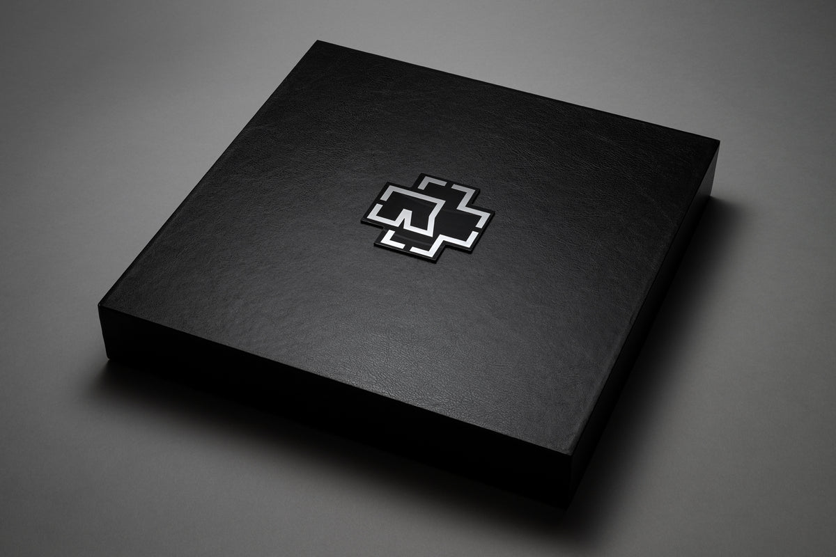Black box with a silver logo on a black background