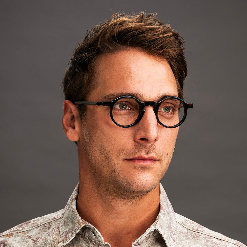 The unisex Aimo features large lenses, and temples made from upcycled bicycle brake cables- Vinylize eyewear