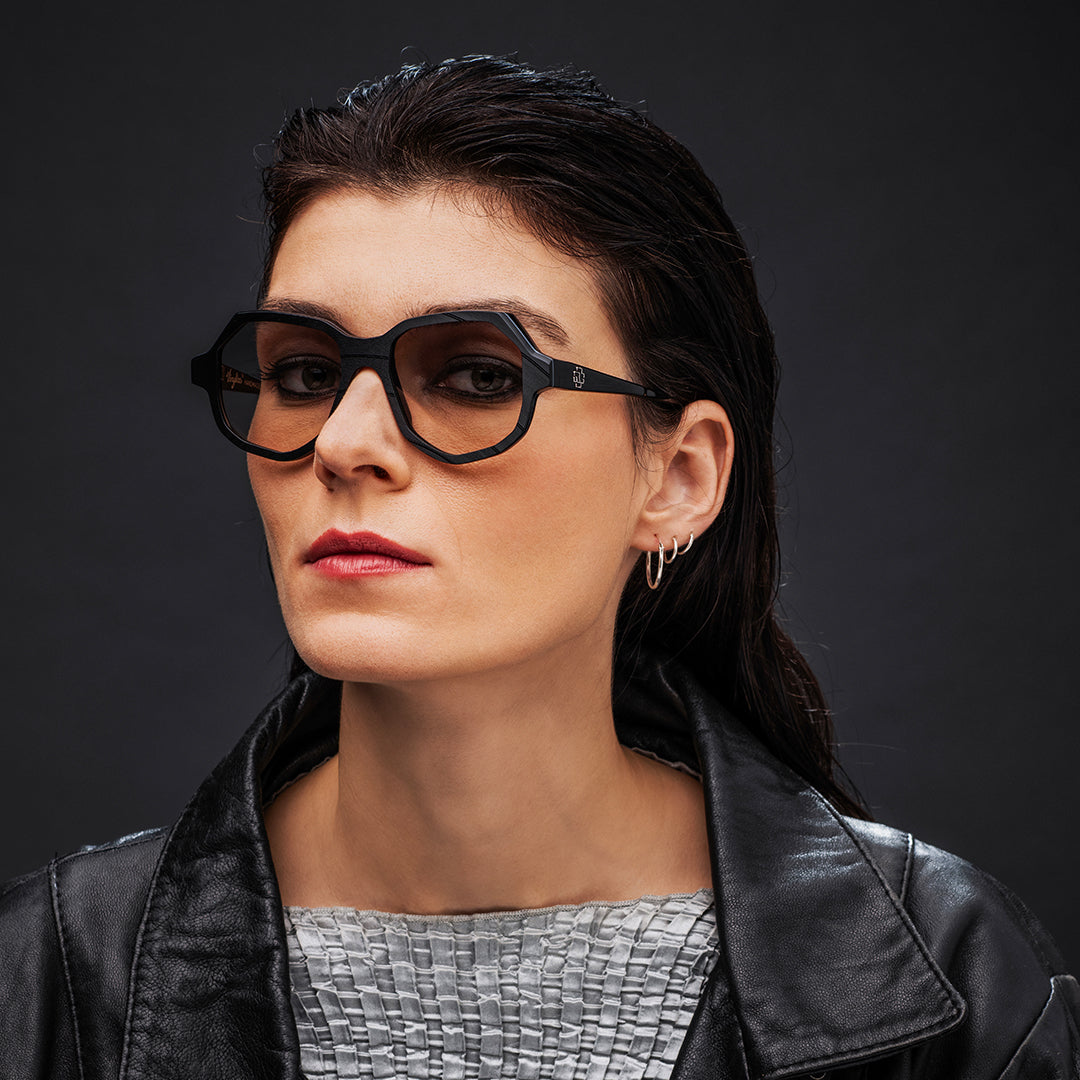 Black Vinylize Rammstein sunglasses with a reflective lens on a white background