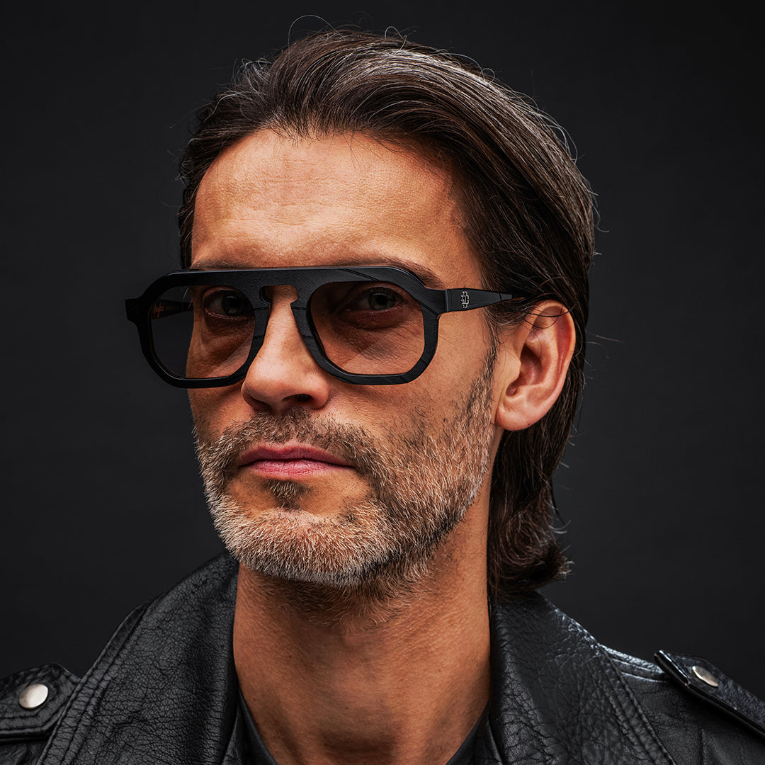 Black Vinylize Rammstein sunglasses with reflective lenses on a white background